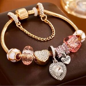 Silver, Gold and Pink Charm Bracelet
